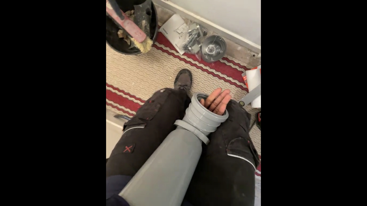 Man struggles to remove stuck PVC pipe from hand in Créteil, France
