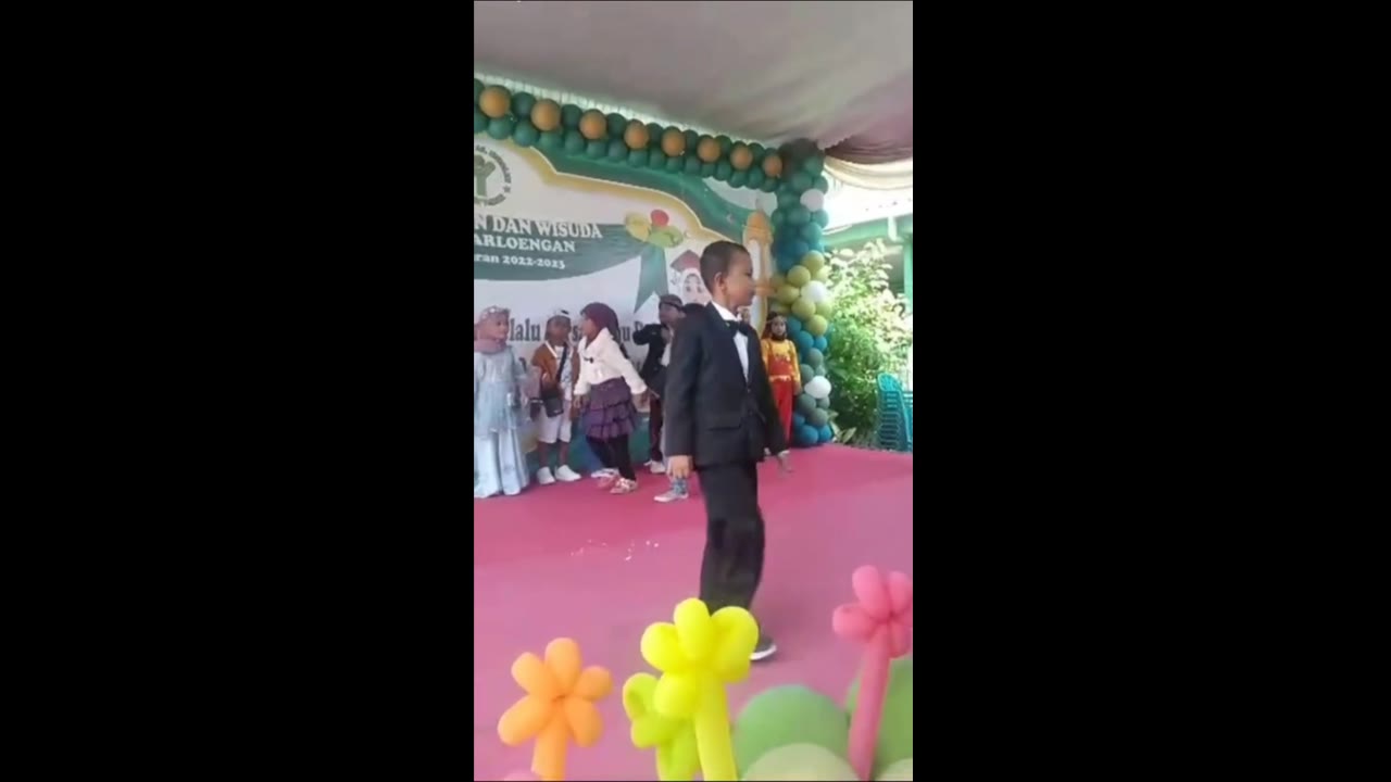 Unforgettable graduation moment as boy mistakes canvas for Wall and takes a tumble
