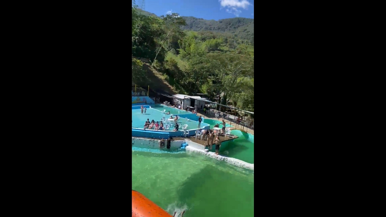 Boys launched mid-air from pool slide in Cocorná, Colombia
