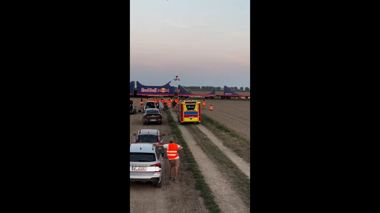 Cyclist performs extreme stunt on moving truck in Biała, Poland