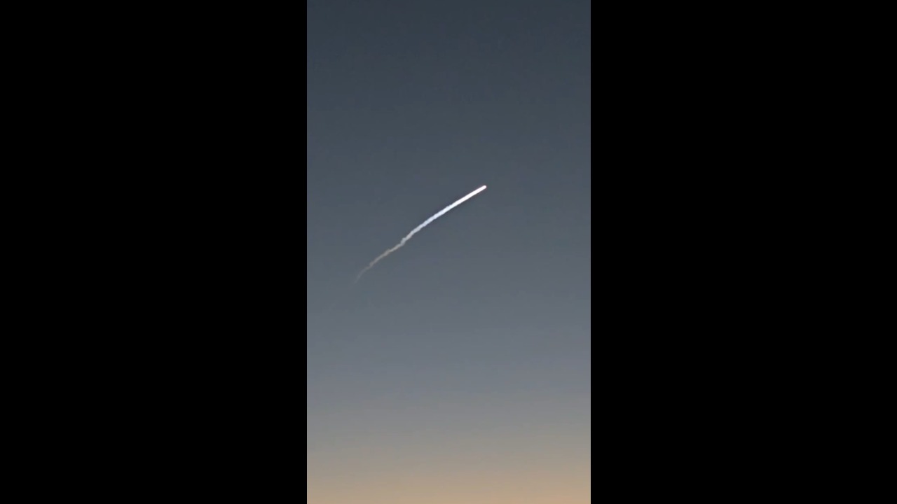 SpaceX rocket launch leaves glowing trail across the sky over Orlando, USA