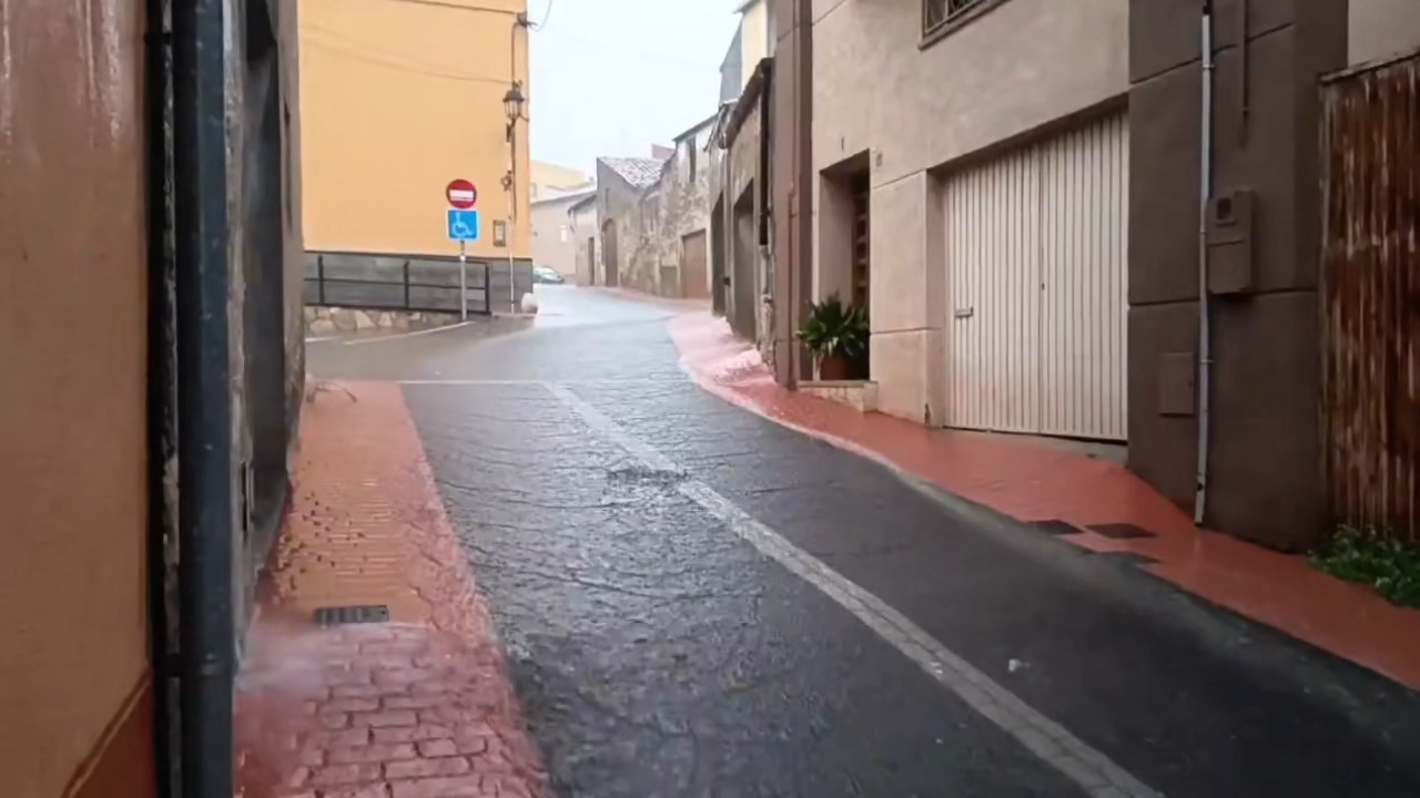 Heavy rainfall floods streets during an intense evening downpour in Tarragona, Spain