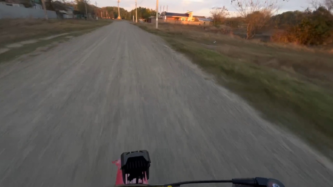 Rider falls off bike after colliding with a sheep on a rural road in Moscow, Russia