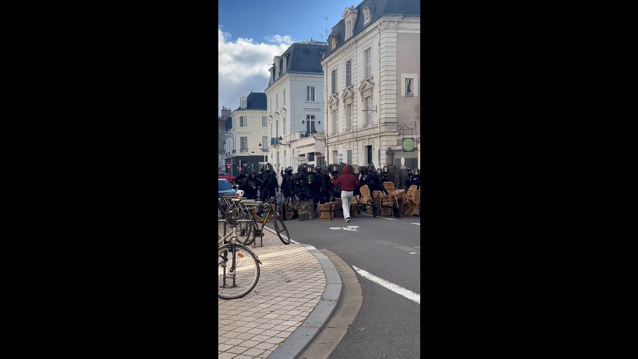 CRS riot police break through makeshift barricade during protest in Tours, France