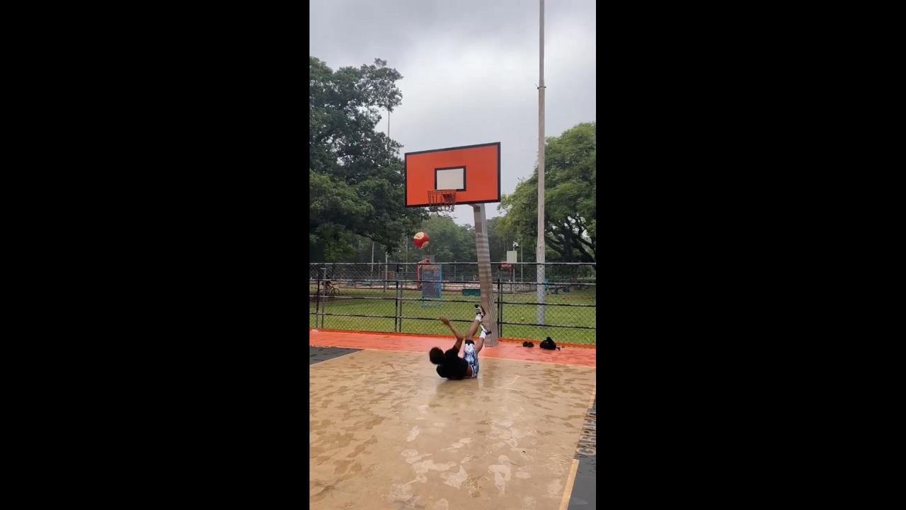 Teen basketball player slips during outdoor game in São Paulo, Brazil