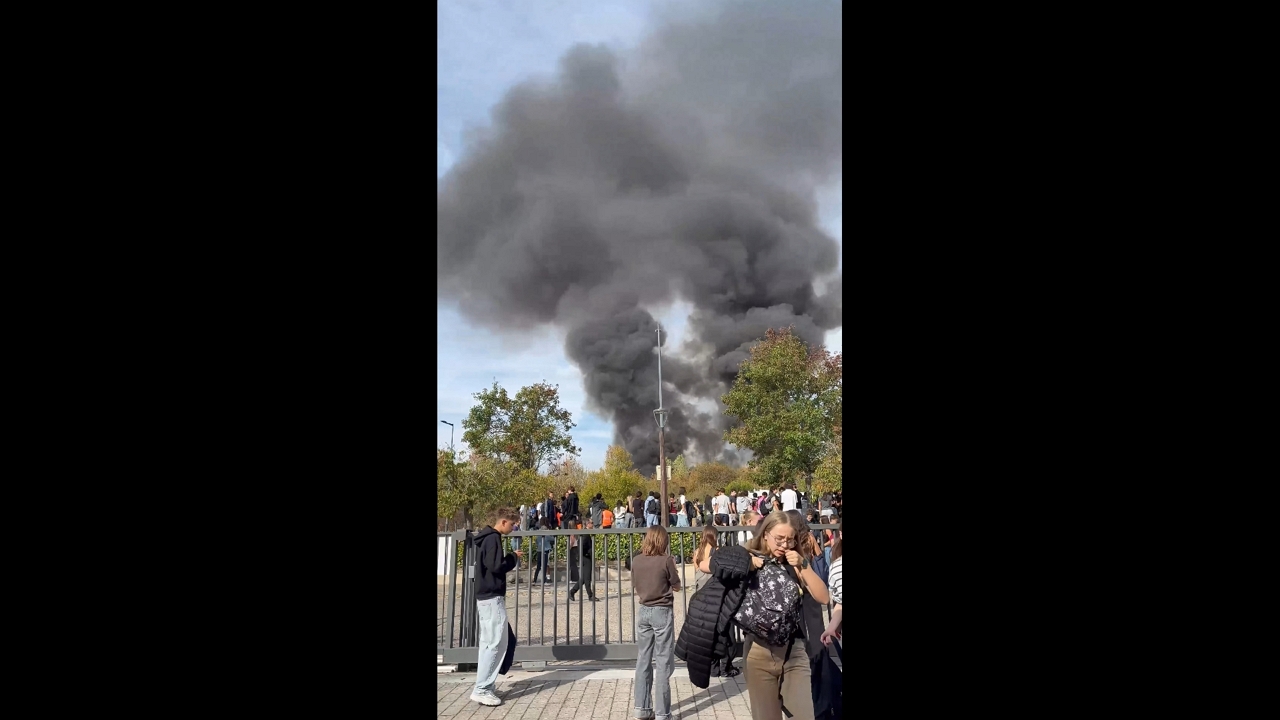 Black smoke rises after fire during high school blockade in Montbéliard, France