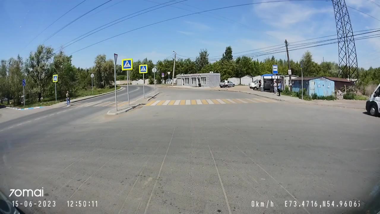 A woman is very lucky at a pedestrian crossing in Omsk, Russia