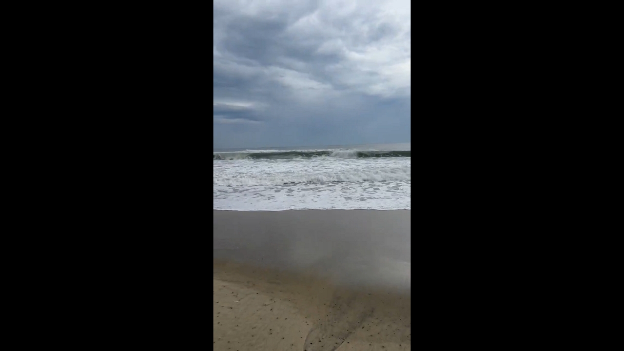 Huge waves and stormy skies at An Bang Beach in Hội An, Vietnam