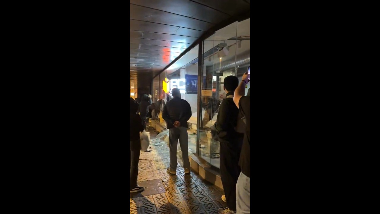 Looters smash storefronts as police respond to unrest on Pelai Street in Barcelona, Spain