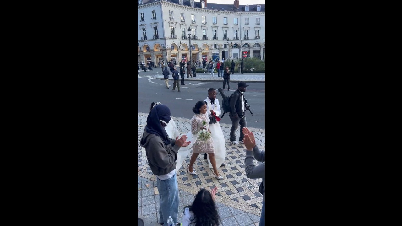 Bride and groom cheered by protesters on their way to city hall in Tours, France