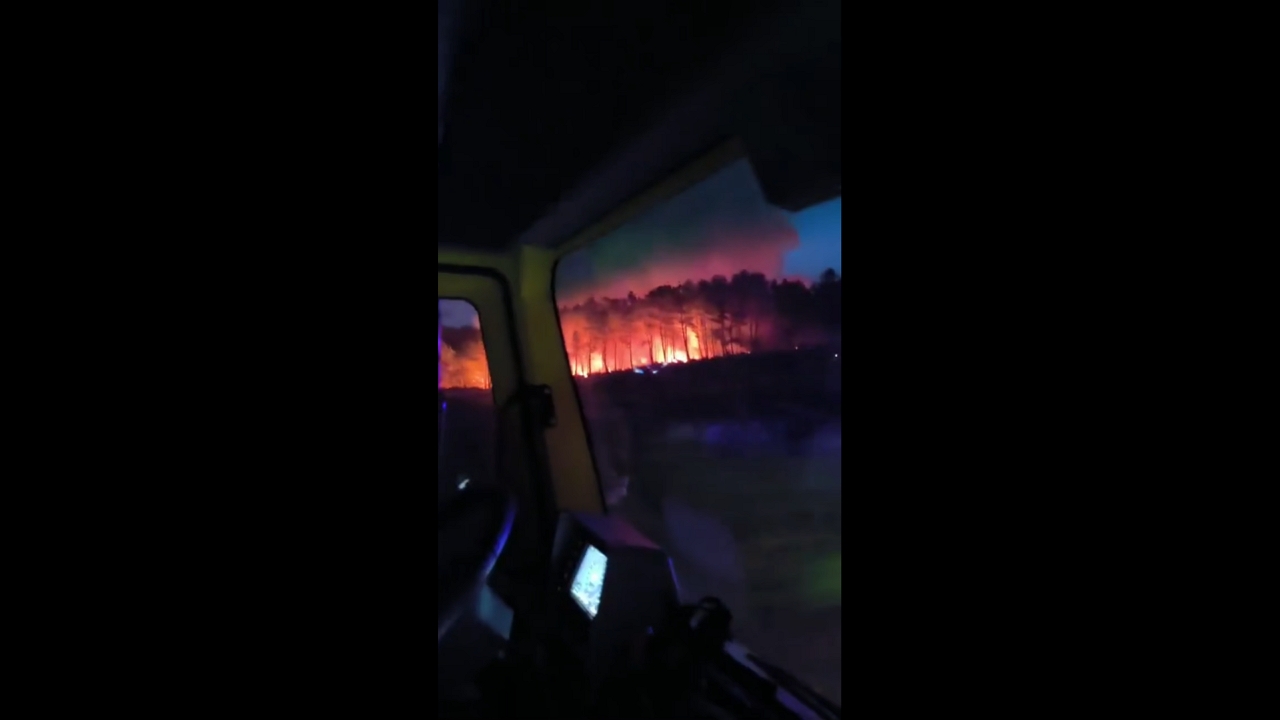 Wildfires blaze through forest fanned by heatwave and strong winds in Muxía, Spain