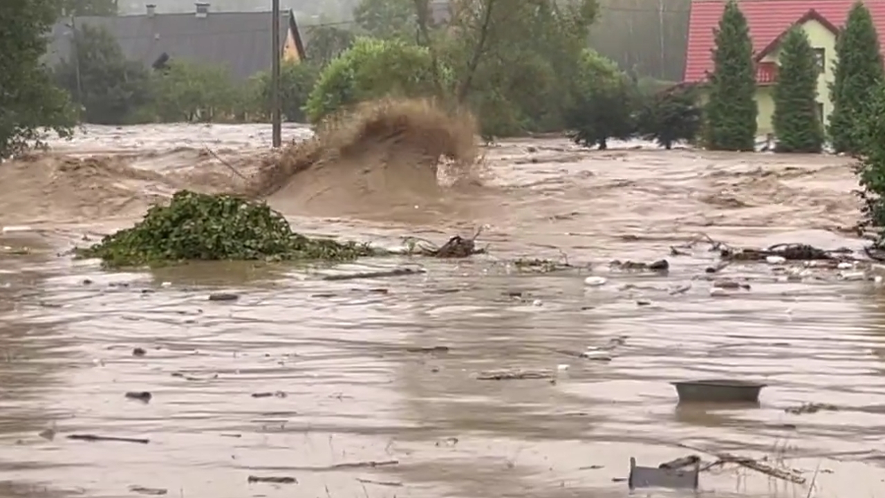 Floodwaters sweep Stronie Śląskie, Poland after dam burst