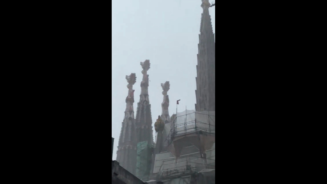 Heavy thunderstorm shrouds Sagrada Família amid torrential rain in Barcelona, Spain