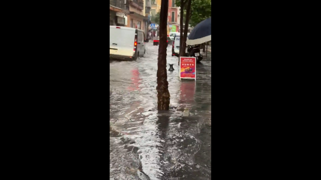 Floodwaters inundate García de Vinuesa Street in Seville, Spain