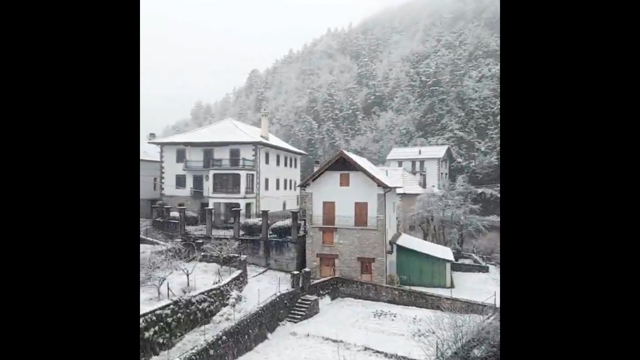 Fresh snow blankets Uztárroz in serene winter scene, Spain