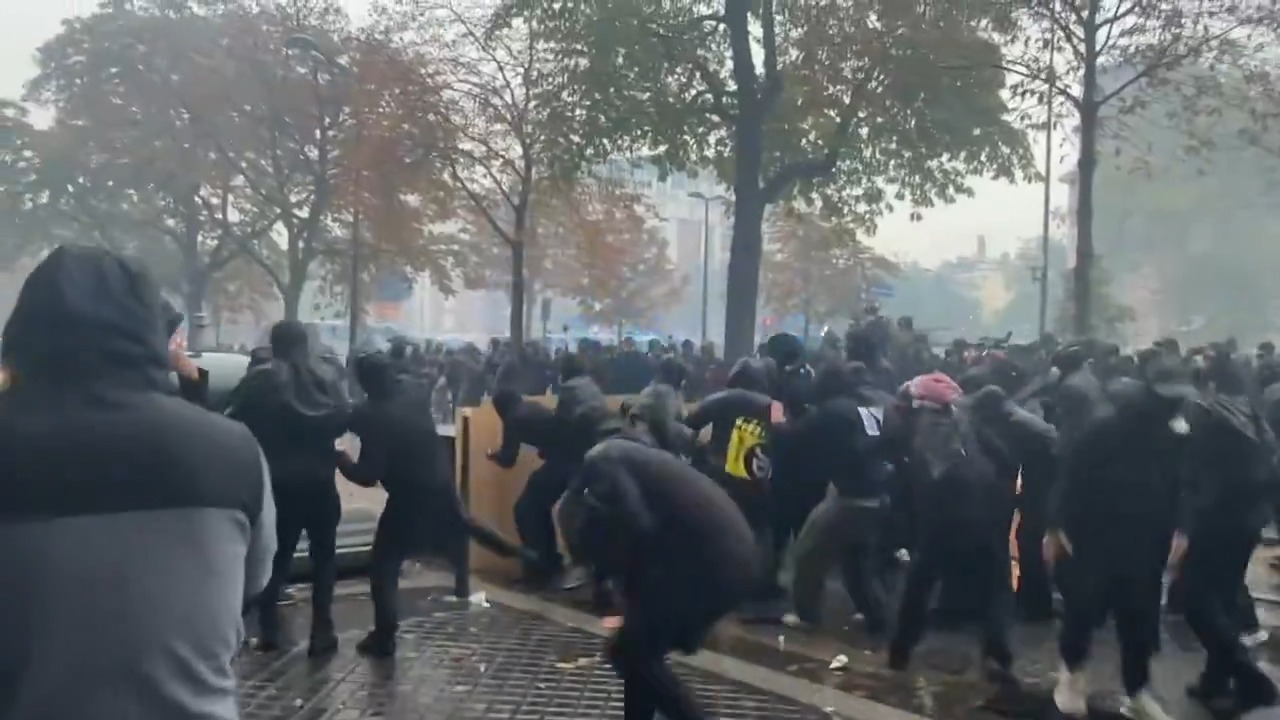 Black bloc demonstrators clash with police as cost-of-living protest turns violent in Paris, France