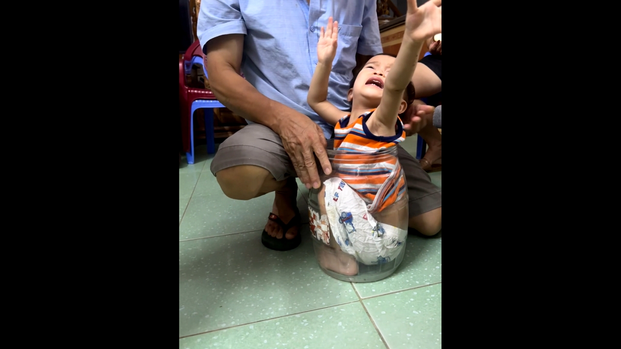 Playful child gets stuck in jar in Lào Cai, Vietnam