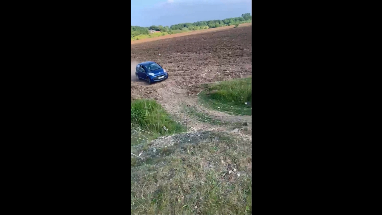 Citroën C1 jumps on muddy private land in Doncaster, England, UK