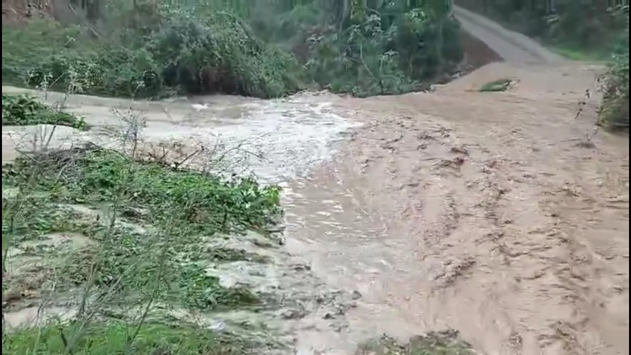 Flash floods sweep through a rural road as muddy water surges across Albinyana, Spain