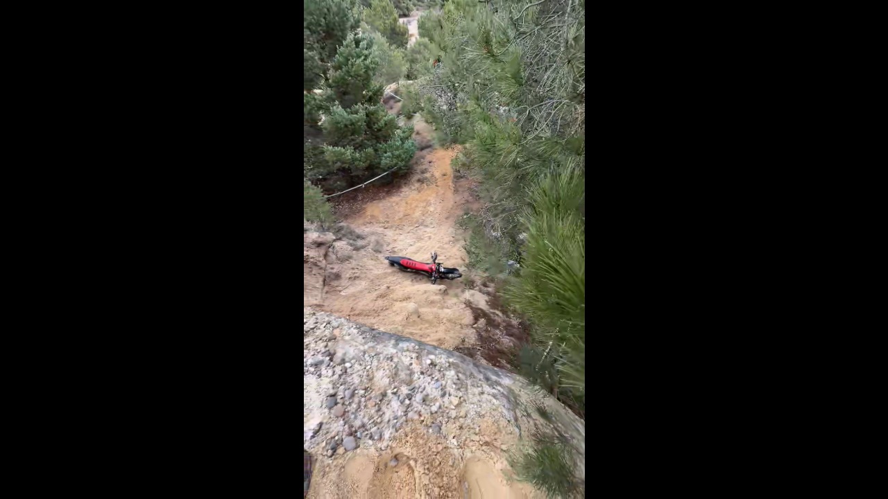 Enduro riders struggle to navigate a challenging rocky trail during competition in Golmayo, Spain