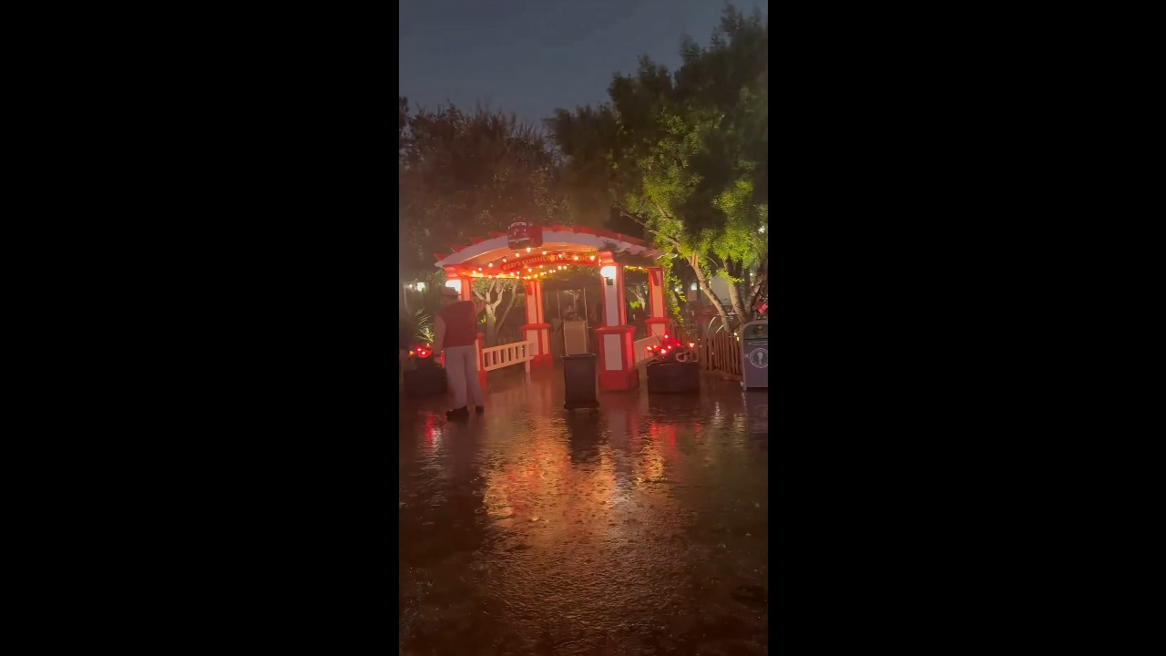 Flash flooding submerges walkway at Disneyland Resort in Anaheim, California, USA