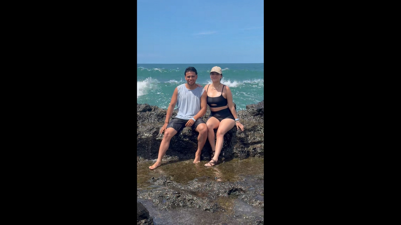 Man and woman knocked off rock by wave while taking photo in Capurganá, Colombia