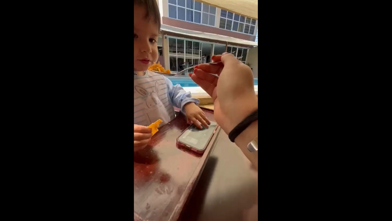 Baby quickly reacts after eating hot food during mealtime in Tehuacán, Puebla, Mexico