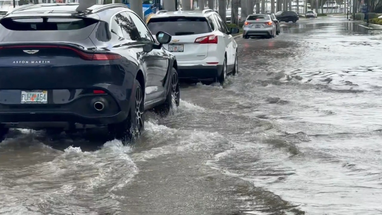 King Tides flood Las Olas Boulevard, submerging streets and parking areas in Florida, USA