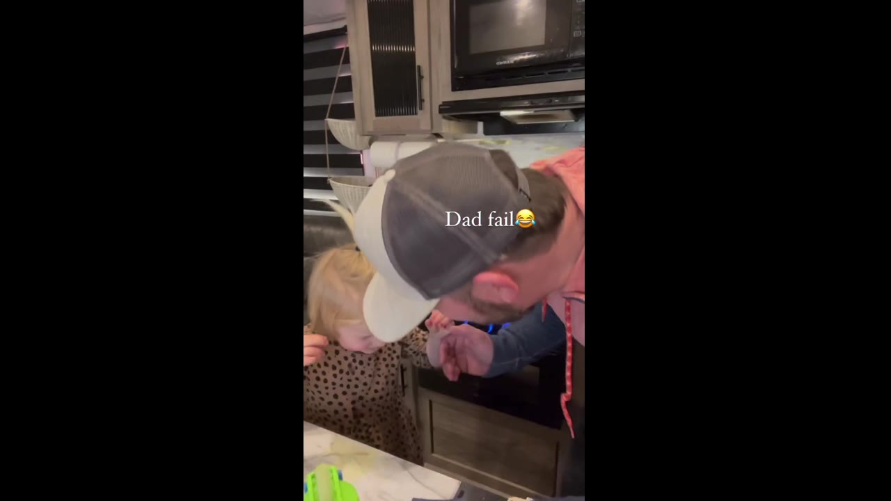 Funny mishap: toddler gets drink in her eyes, dad can't stop laughing!