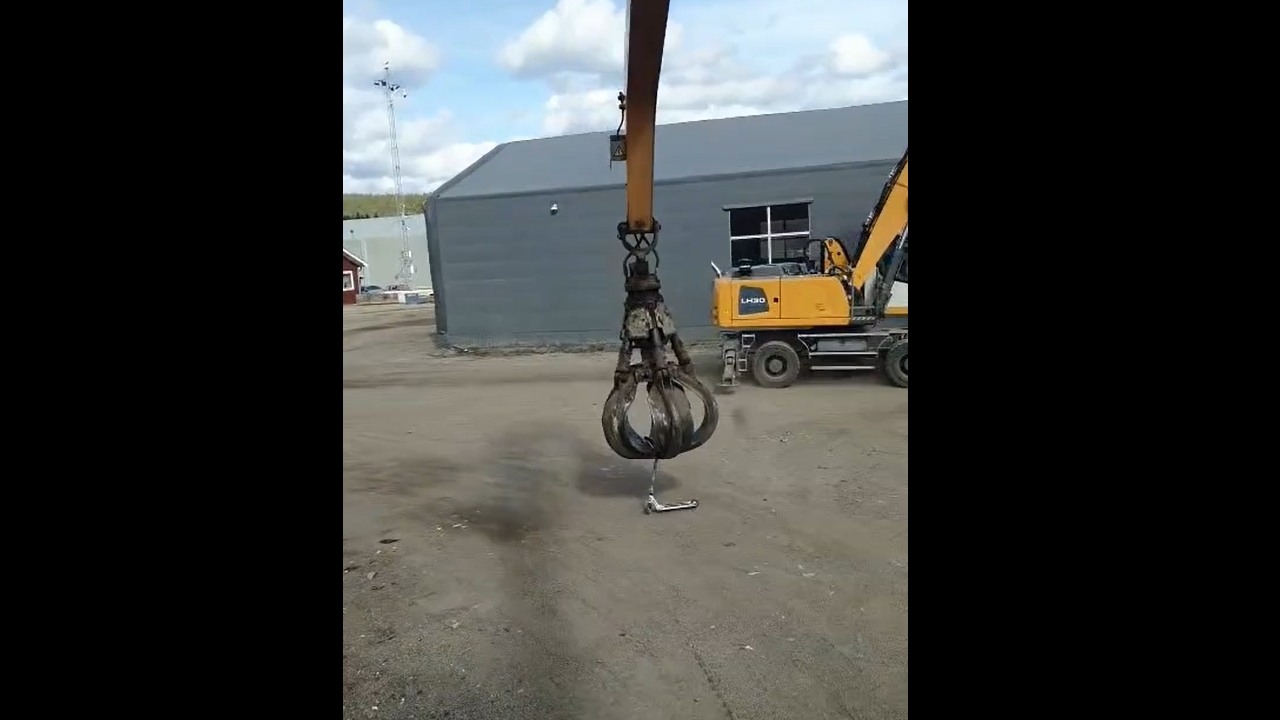 Person picks up scooter with crane arm and rides it in Borlänge