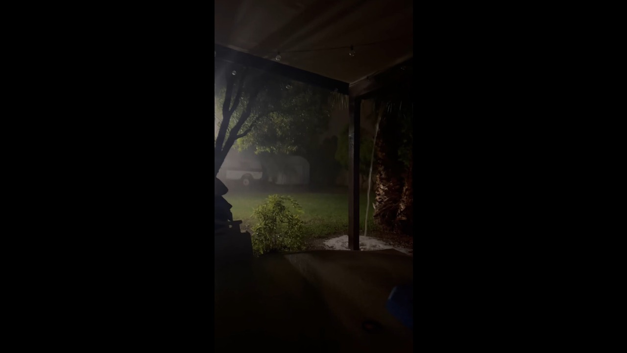 Heavy rain and strong winds batter a residential area during severe thunderstorms in Mesa, USA