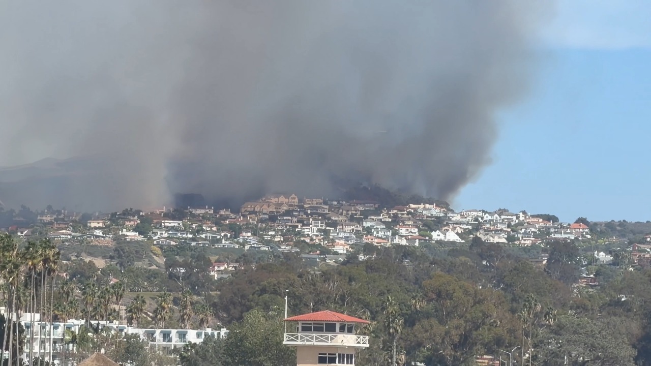 Air tanker drops fire retardant over hillsides as Norte Fire spreads in California, USA