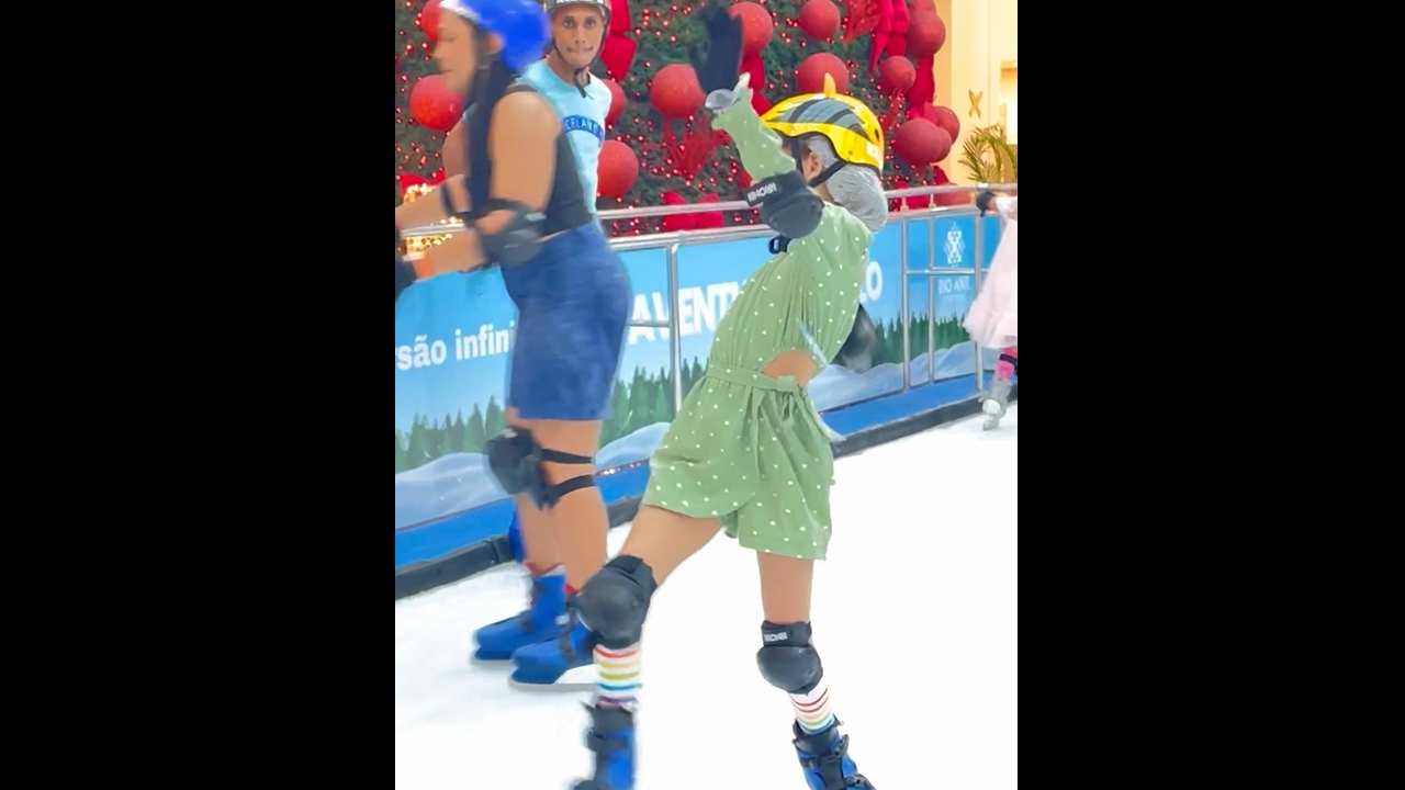 Girl struggles to balance on ice skates in São Luís
