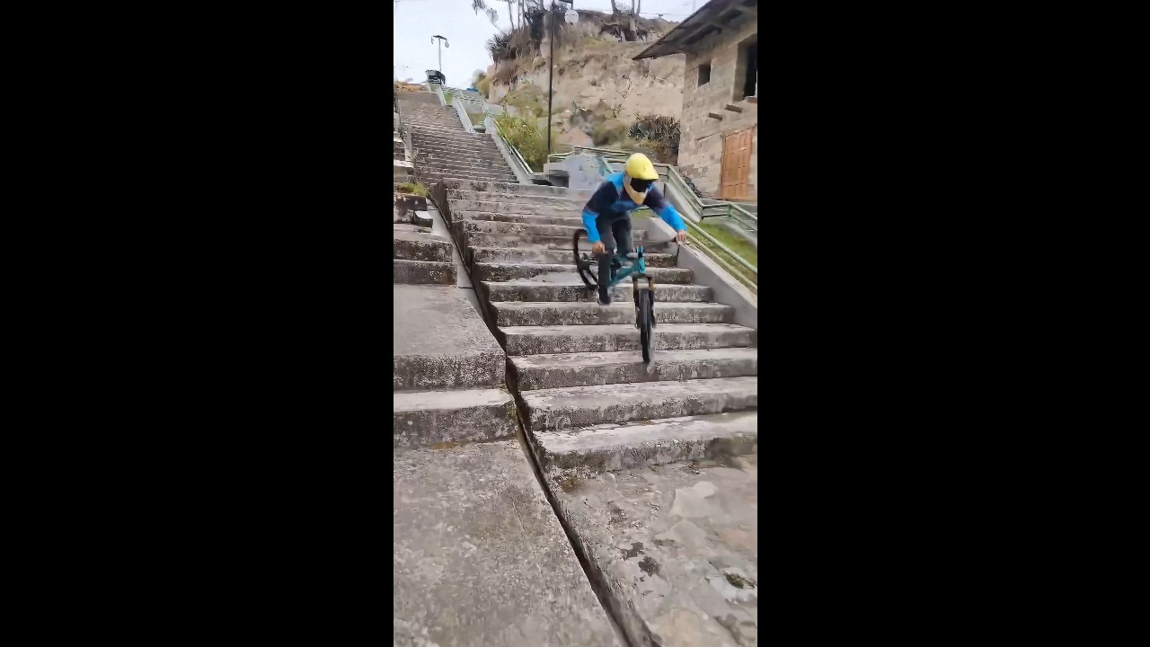 Teen mountain biker loses balance and crashes on a steep staircase in Bambamarca, Peru