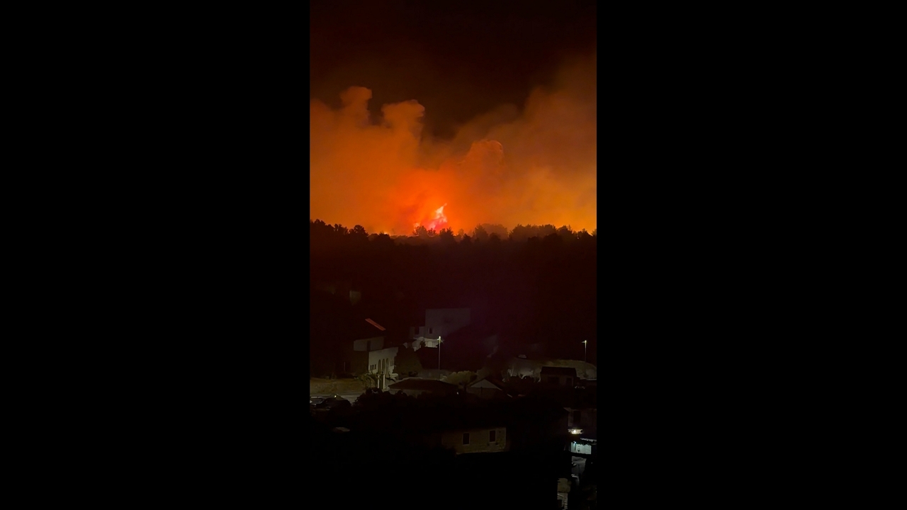 Massive wildfire glows behind residential area in Milna, Brač, Croatia