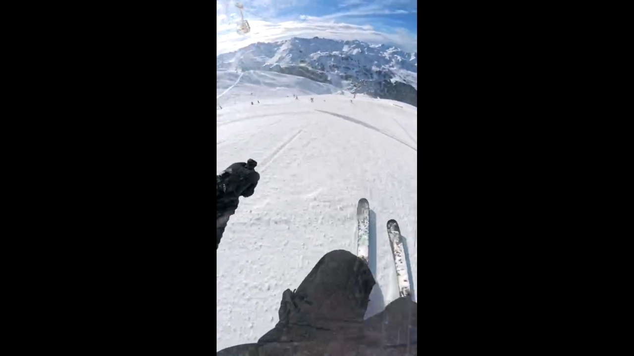 Skier takes a tumble after small jump on snowy slope in Québec, Canada