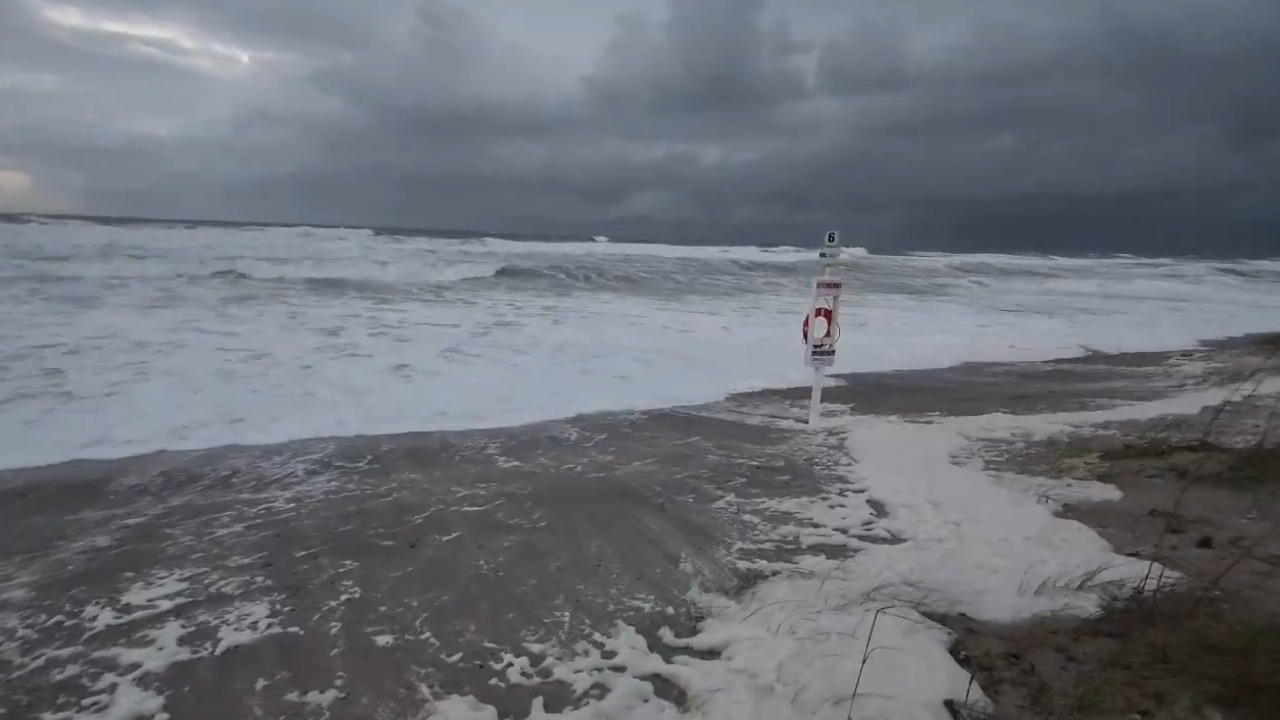 Severe coastal flooding submerges the beach and erodes the dunes in Brevard, USA