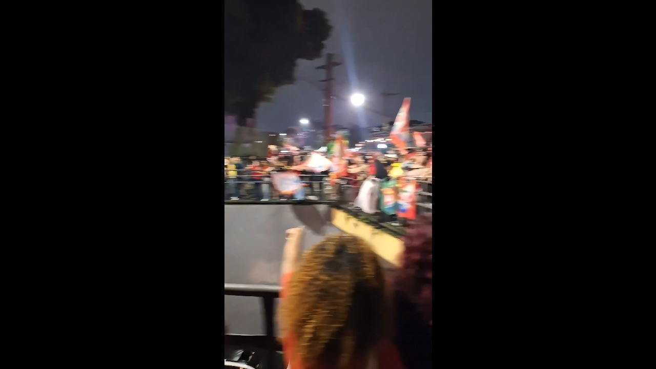 Supporters celebrate Lula’s reelection from an overpass in Curitiba, Brazil