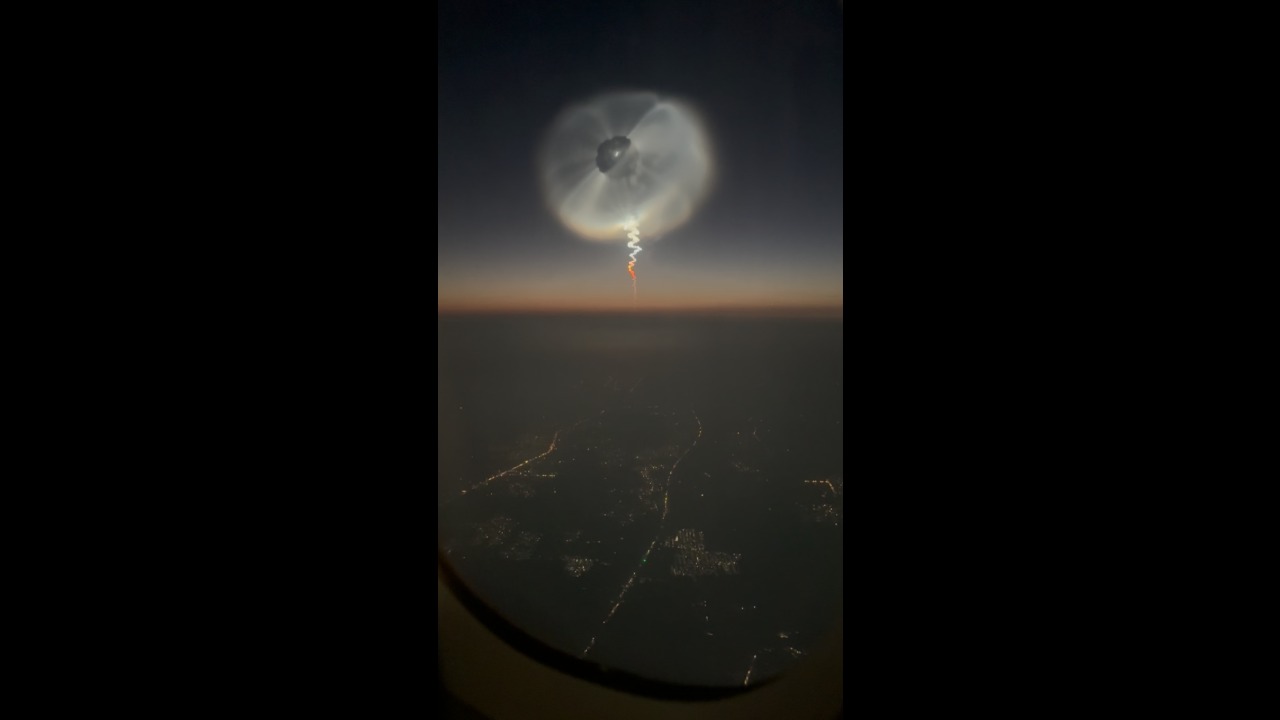 Rocket launch creates a glowing space jellyfish in the sky over Beijing, China