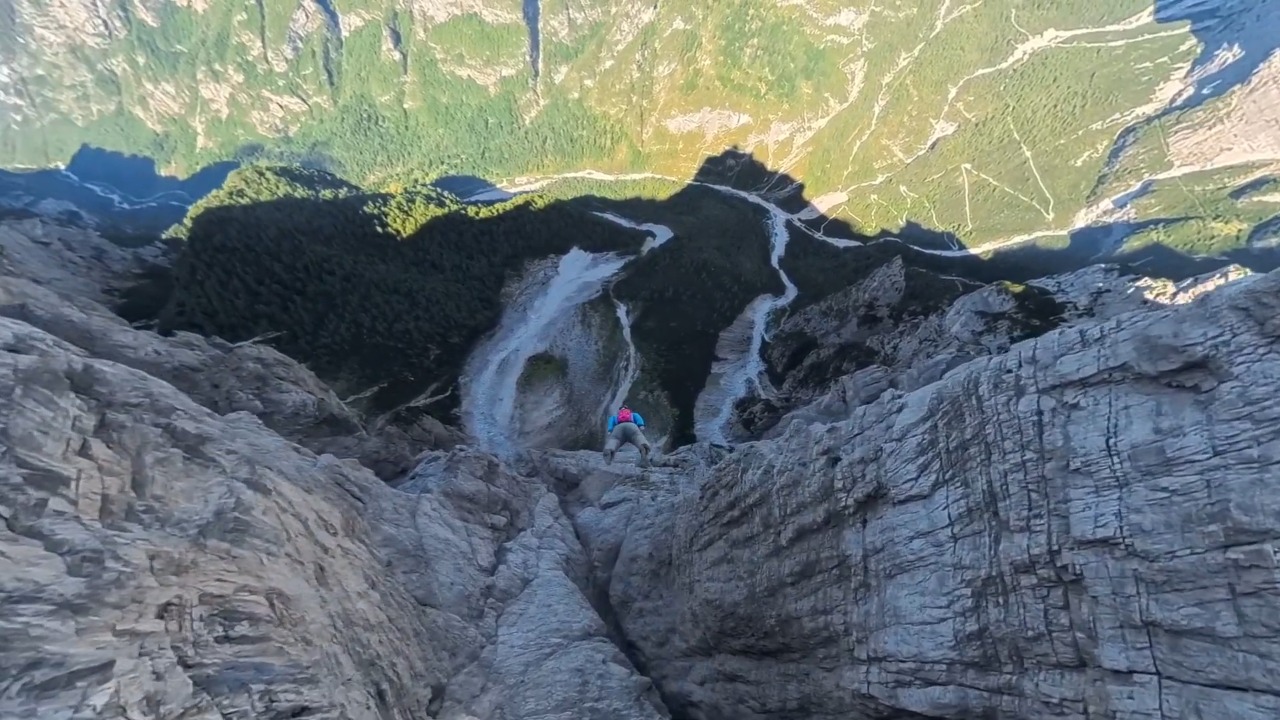 Professional skydiver performs a low-altitude wingsuit flight over mountains in Shandong, China