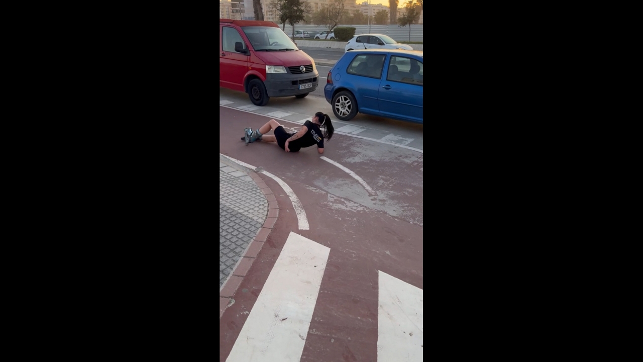 Roller skater loses balance during sunset in Málaga, Spain