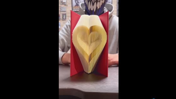 Unfolding love: crafting a heart through book folding