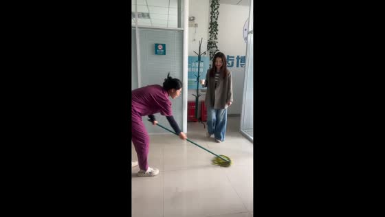 Woman slips while stepping over mop in Inner Mongolia, China