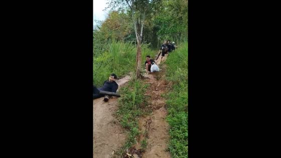 Friend slips and falls in muddy area in Bukit Guling, Kalimantan Selatan, Indonesia