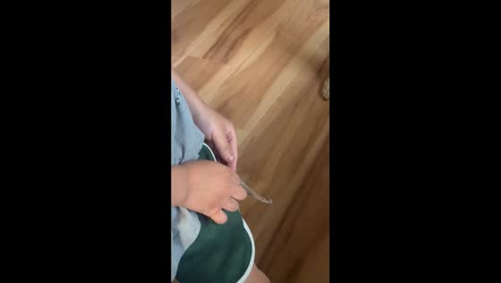 Boy shows snake inside his pocket in Anderson, Indiana, USA