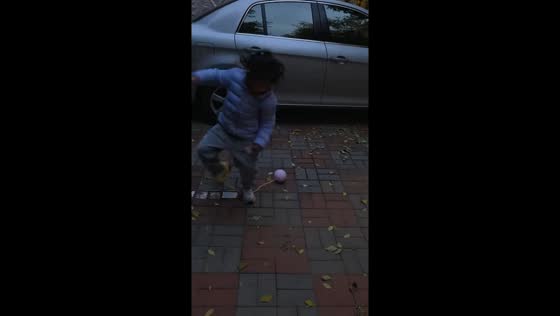Girl trips while playing with rope and ball in Liaoning, China