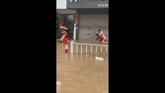 Rescue workers assist residents through flooding in Rui'an, China