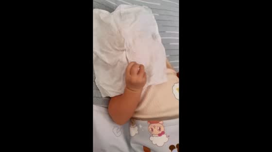 Baby makes funny finger gesture in Surabaya, Indonesia