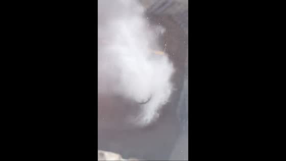 Heavy rain causes manhole water burst in Chicago, Illinois, USA