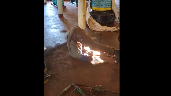 Welder in Tacoma works upside down to access work area